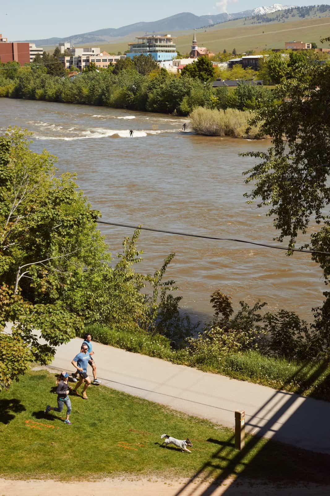 Joggers and surfers at the Clark Fork River in Missoula, Montana