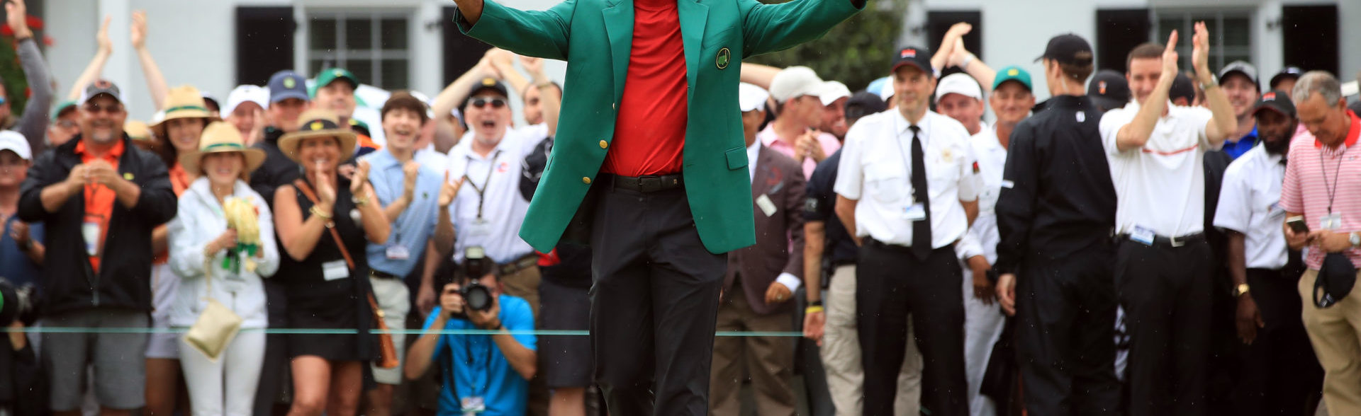 Tiger Woods waves to fans at the Masters.