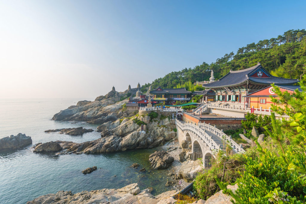 A colorful Korean village next to the coast.