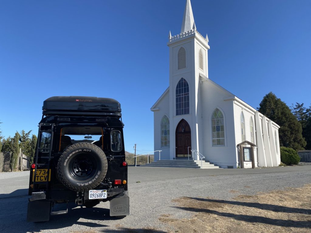 a car in front of a church